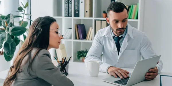 depositphotos_210632146-stock-photo-patient-general-practitioner-looking-laptop