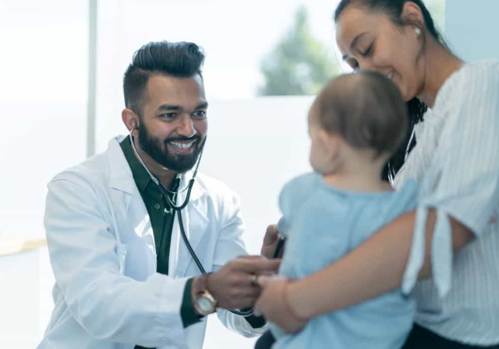 pediatrician_examining_infant_girl
